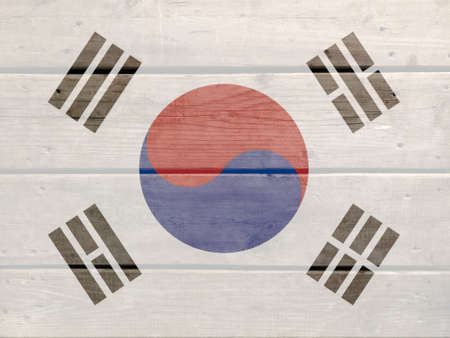 Korea flag painted on wood plank background. Brushed natural light knotted wooden board texture. Wooden texture background flag of Koreaの写真素材
