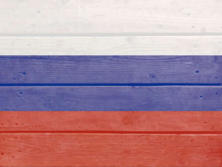 Russia flag painted on wood plank background. Brushed natural light knotted wooden board texture. Wooden texture background flag of Russiaの写真素材