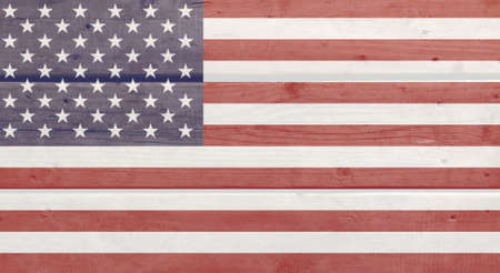 United States of America flag painted on wood plank background. Brushed natural light knotted wooden board texture. Wooden texture background flag of USAの写真素材