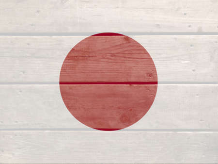 Japan flag painted on wood plank background. Brushed natural light knotted wooden board texture. Wooden texture background flag of Japanの写真素材