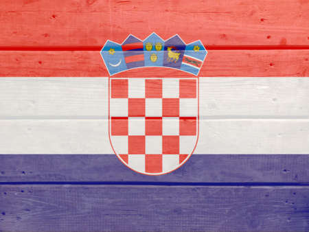 Croatia flag painted on wood plank background. Brushed natural light knotted wooden board texture. Wooden texture background flag of Croatiaの写真素材
