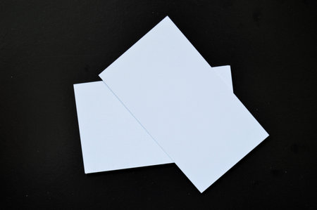 White blank paper on a black background.