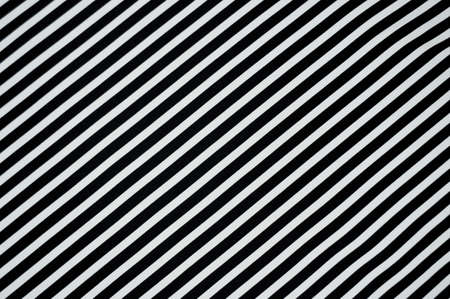 Black and white graphic striped fabric background.の写真素材