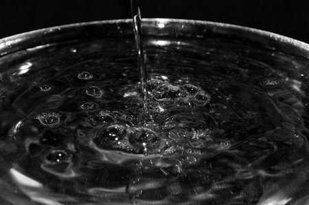 stream of water on a black background.