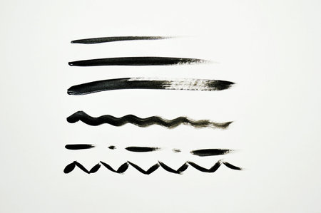 paint colorful on a white background. Various strokes of black watercolor paint