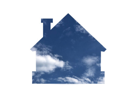 blue sky with white clouds. Shot through the cut-out silhouette of the house.の写真素材