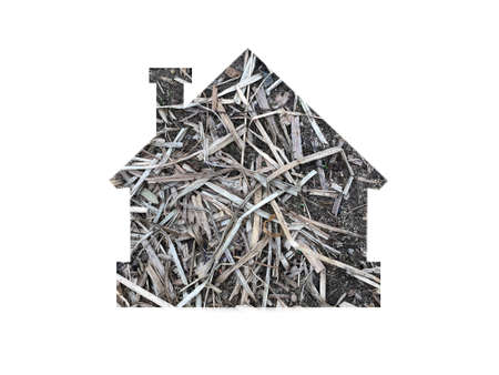 gray straw texture. Shot through the cut-out silhouette of the houseの写真素材