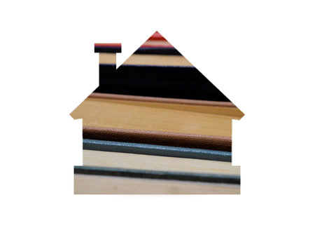 Lots of multi-colored books with multi-colored bookmarks close-up. Shot through the cut-out silhouette of the house.の写真素材