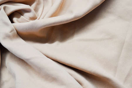 Light pink textile pattern as a background. Close up on Light pink material texture on fabric. crumpled fabric textureの写真素材