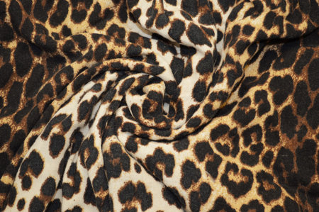 Leopard print textile as a background. Close up on Leopard print material texture on fabric....
