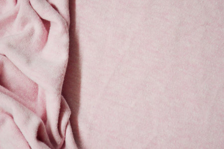 Pink textile pattern as a background. Close up on Pink material texture on fabric. crumpled fabric...