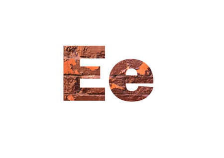 Brown texture brick wall. Shot through the cut-out silhouette of the letter Eの写真素材