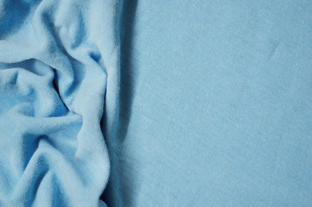 Blue textile pattern as a background. Close up on Blue material texture on fabric. crumpled fabric textureの写真素材