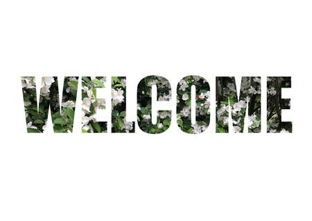white flowers with green leaves. Shot through the cut-out silhouette of the word WELCOMEの写真素材