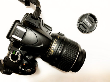 Moscow, Russia, May 2021, Nikon camera with lens on white background