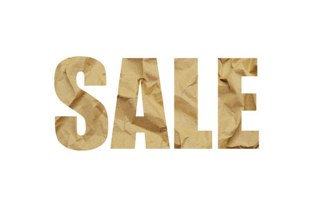 Textured obsolete crumpled packaging brown paper background. Shot through the cut-out silhouette of the word SALEの写真素材