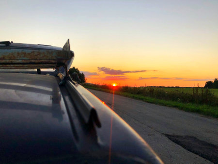 Roof rack of a car close up on sunset background.の写真素材