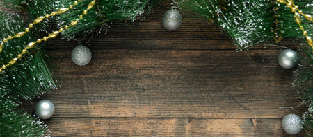 dark wooden background with fir branches and silver Christmas balls. Catholic Christmas Eve. Christmas Card Day. new year. Bannerの写真素材