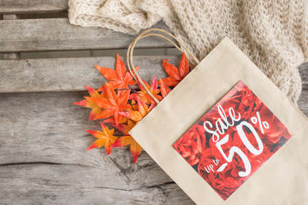 Sale paper bag on the woodの写真素材