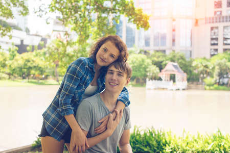 Young couple in the parkon sunny dayの写真素材