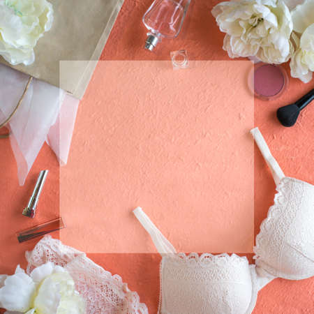 Woman's accesorries on the peach color background. Copy spaceの写真素材
