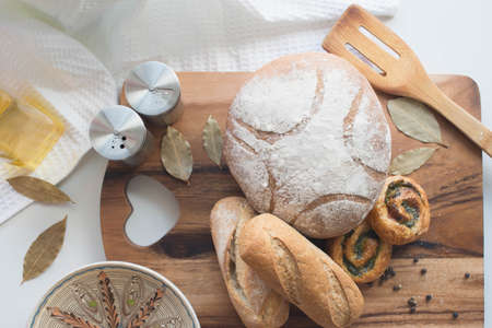 Different kind of bread on the kitchen tableの写真素材