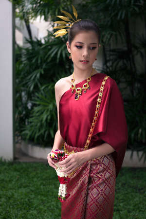 Asian girl wearing thai red dressの写真素材
