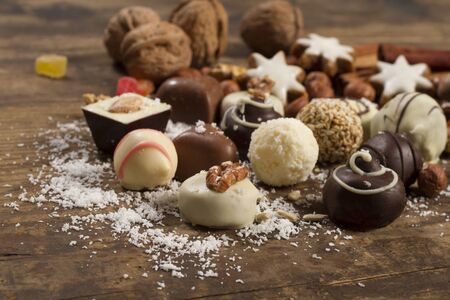 Various handmade chocolate on wood backgroundの写真素材