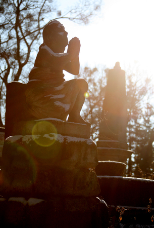 Old cemetery with desperate statuesの写真素材