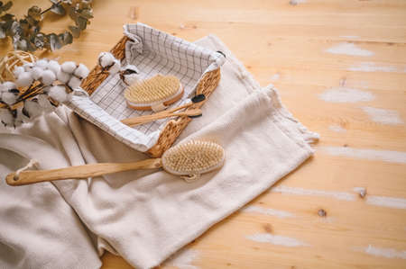 Zero waste bathroom accessories flat lay wooden desk background, spa body care concept. Natural sisal body brushes for dry anti-cellulite massage, black bamboo toothbrushes. Eco-friendly lifestyleの写真素材