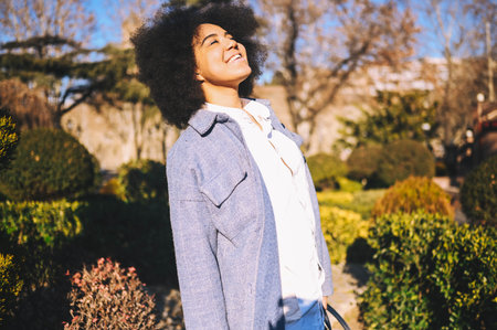 Close up Fashion street style portrait of attractive young natural beauty African American woman...