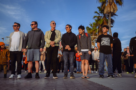 9 March 2024, Los Angeles, USA. Performance by dancers and artists in crowd of tourists on Venice beach, California. Street talent show in public place with a lot of audiences excite and enjoyのeditorial素材