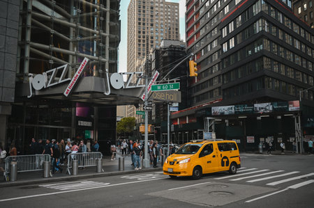 New York, USA, May 7 2023. Streets full of people crowd in Manhattan in the summer. Big city urban life concept background. Famous attractions places, touristic buses and yellow cabsのeditorial素材