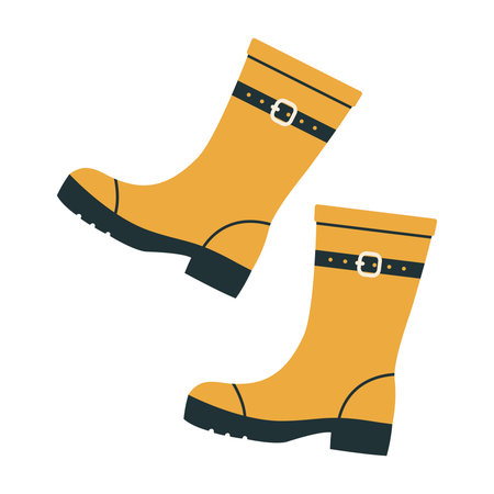 Yellow rubber boots with belt and buckle. Seasonal waterproof footwear. Autumn and spring protective...