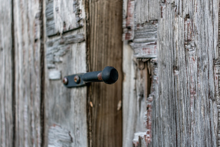 close up of old rusted lock on a weathered wood fenceの写真素材