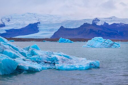 Beautiful photo of Jokulsarlon Glacial lake full of blue floating icebergsの写真素材