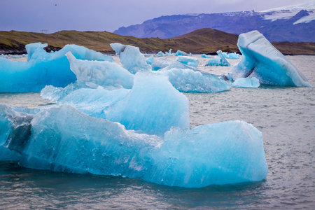 Beautiful photo of Jokulsarlon Glacial lake full of blue floating icebergs