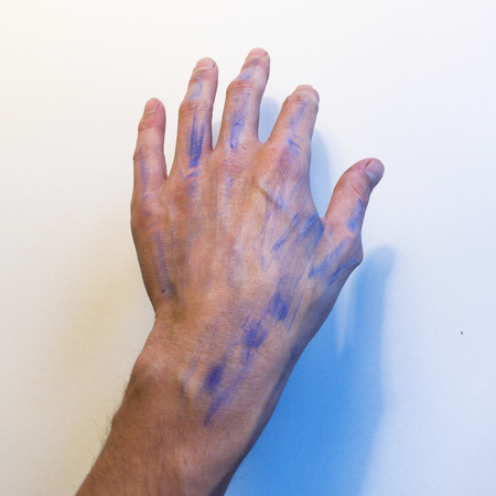 Hand with blue streaksの写真素材