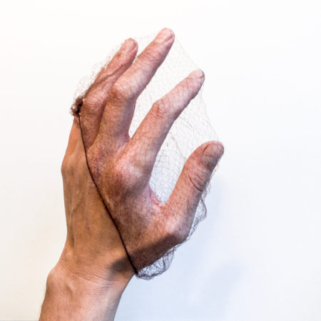 Hand caught in netの写真素材