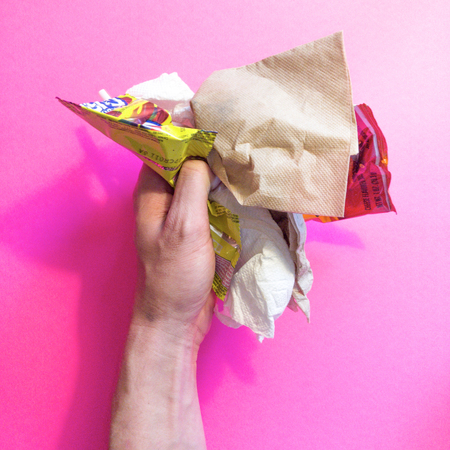 hand holding trashの写真素材