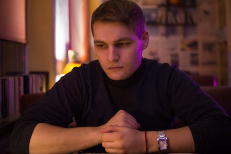 a young guy in a cafe