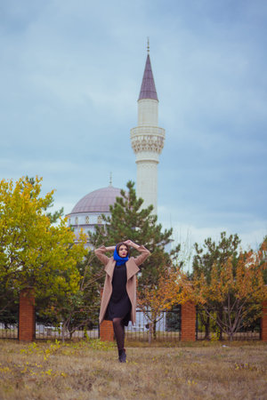 beautiful girl on the background of the mosqueの写真素材