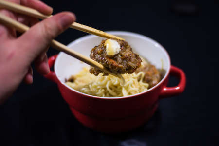 take meatballs with chopsticksの写真素材