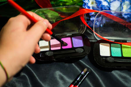 Makeup brushes with a set of eye shadowの写真素材