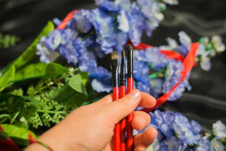 Makeup brushes with a set of eye shadowの写真素材