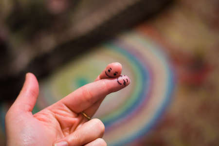 Fingers in love. The hand of man. Muzzles on the phalanges of the fingers. Love on the hand.の写真素材