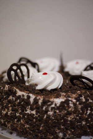 festive cherry cake with cream and shavings of chocolateの写真素材