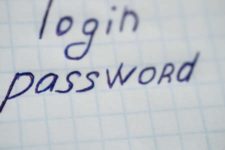 login and password written in letters on paper in a boxの写真素材