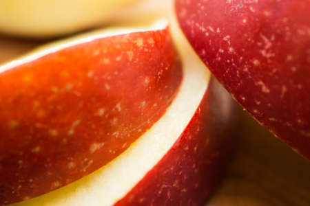 red apple with slices of sliced ??appleの写真素材