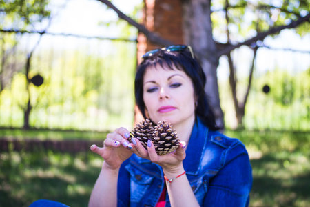 Woman with cones in hands
